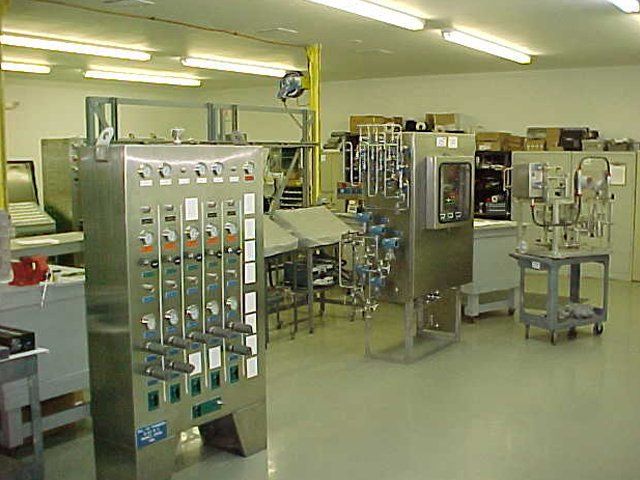 A room with a lot of stainless steel equipment in it