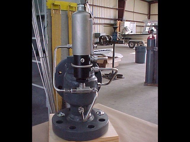 A metal object with a cylinder attached to it