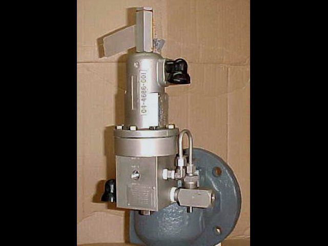 A valve is sitting on top of a cardboard box on a table.