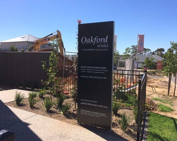 tall black display home sign
