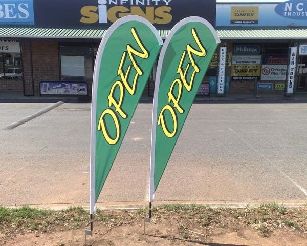 green teardrop signs