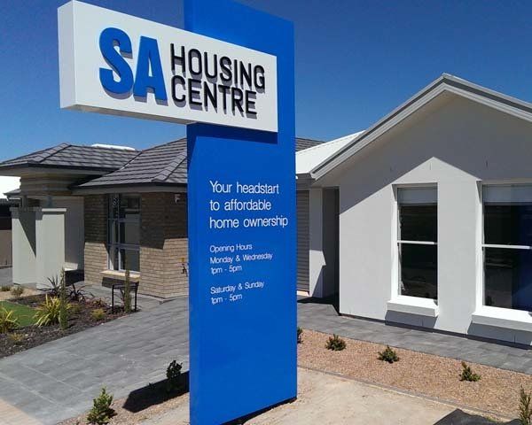 tall blue display home sign