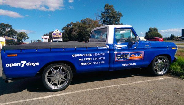blue truck with wrap