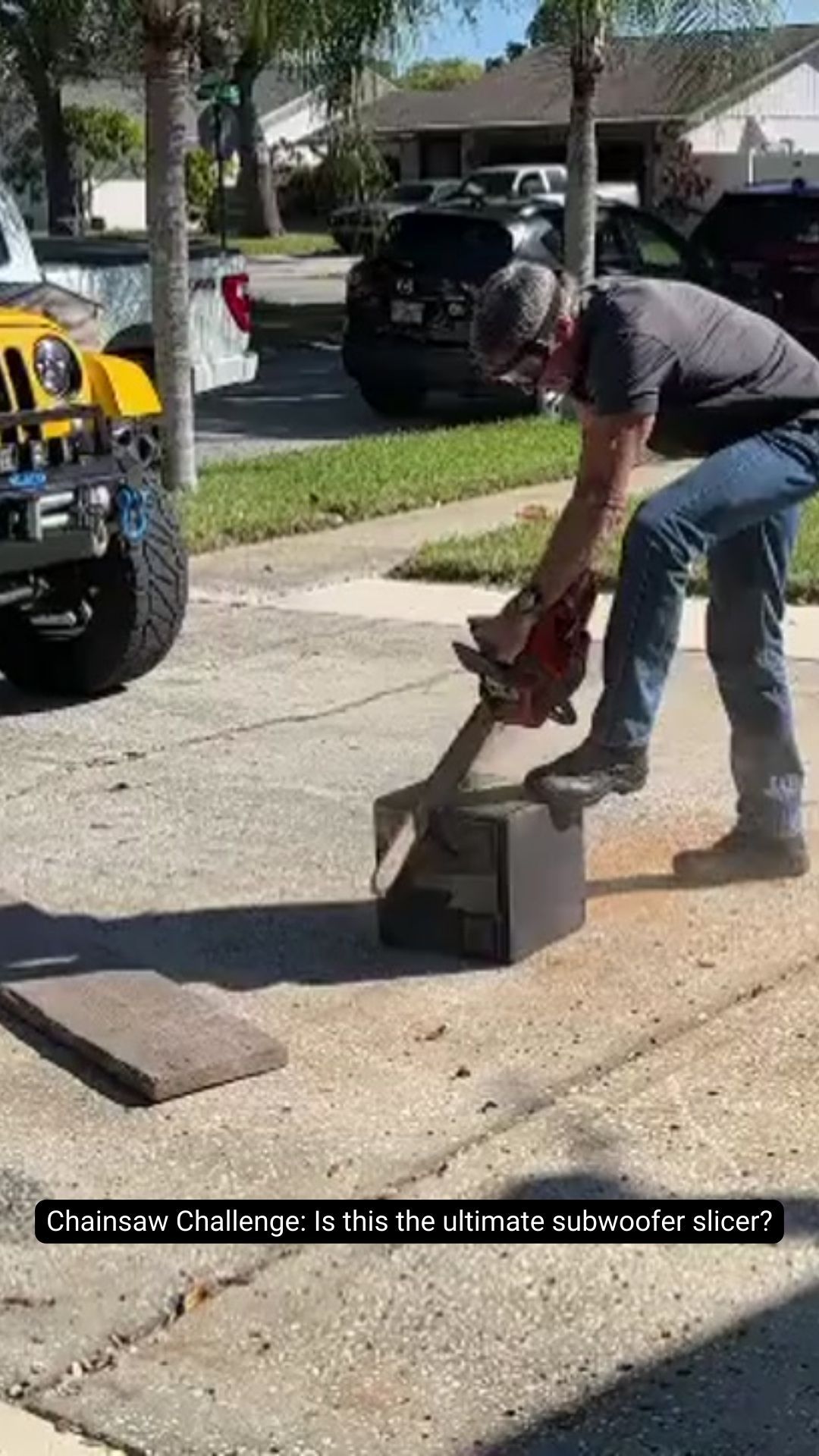 A man is standing next to a box on the side of the road.