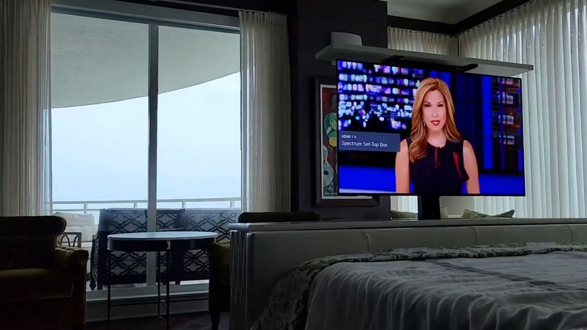 A living room with a flat screen tv on the wall