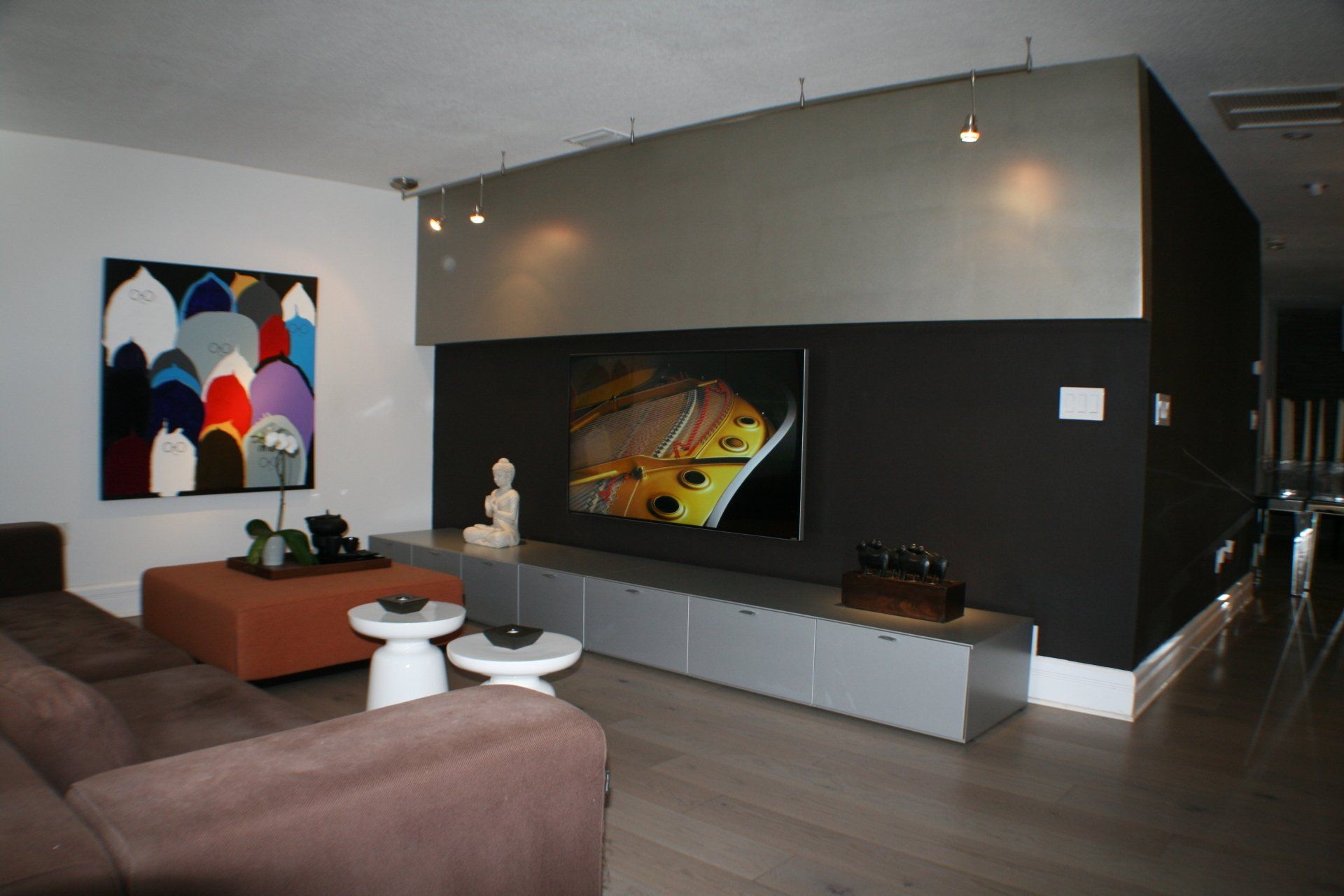 A living room with a couch and a flat screen tv