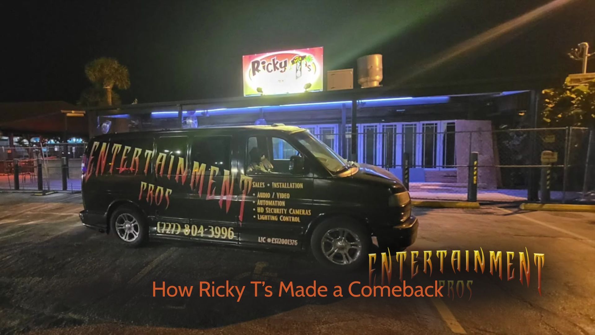 A black van is parked in front of a pizza hut