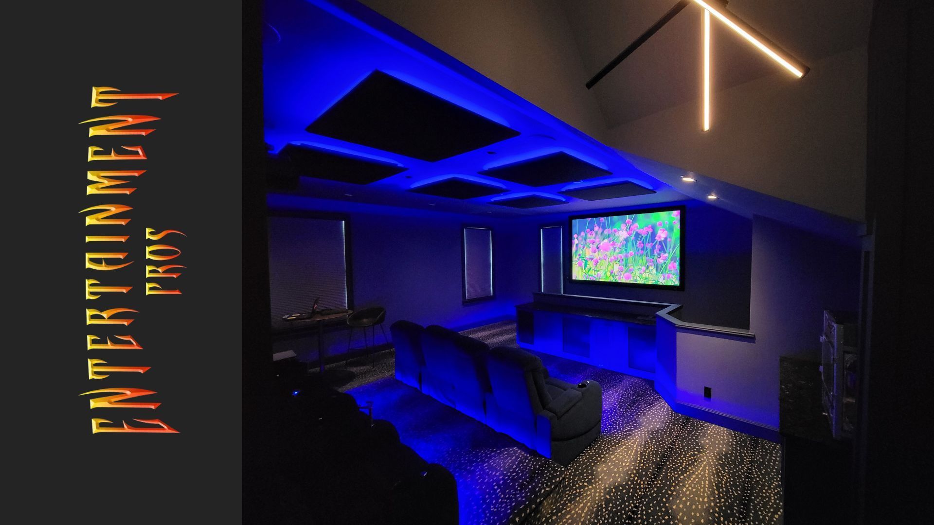 A picture of a home theater with the words entertainment pros on the bottom