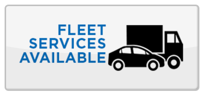 A sign that says fleet services available with a truck and a car.