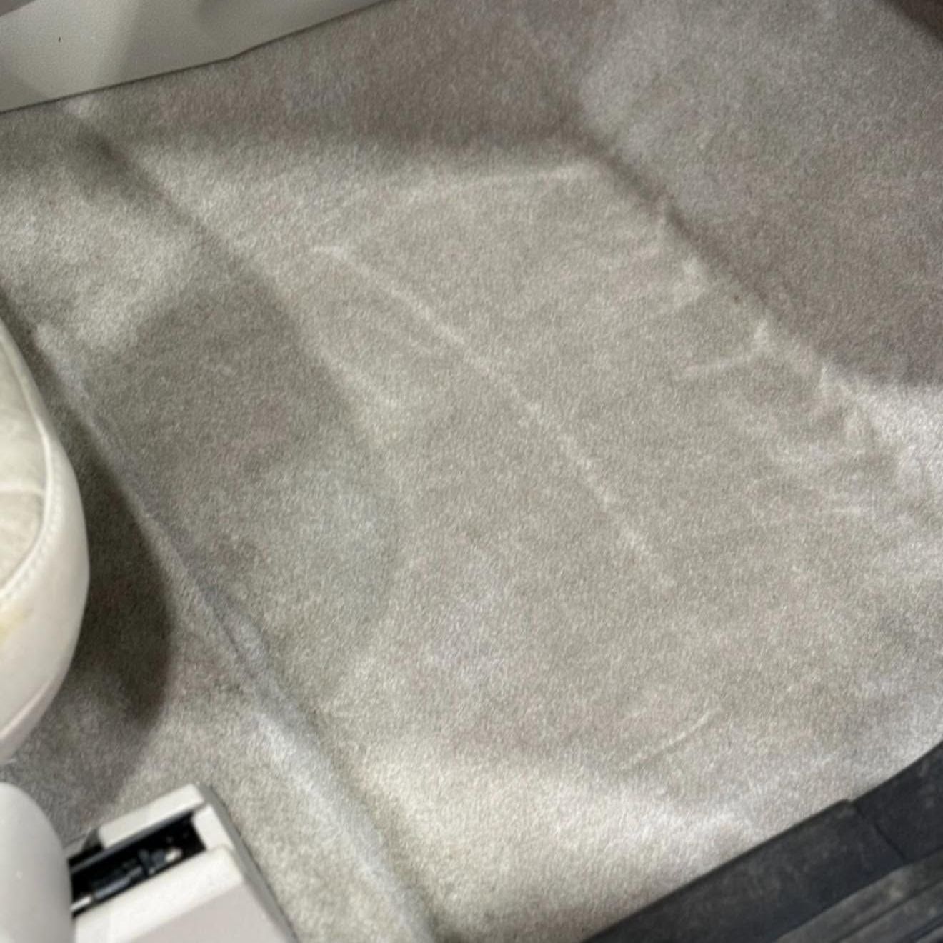 A close up of a clean car carpet after an interior detail.
