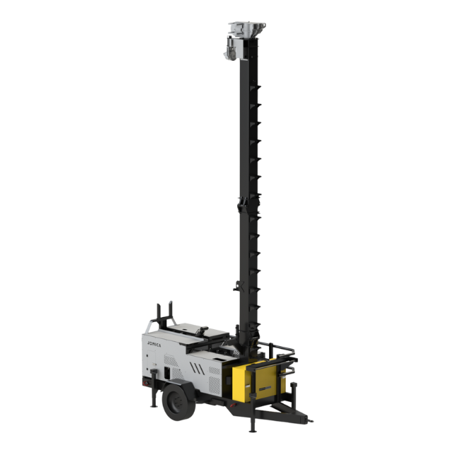 Torre faro mobile, grigia e nera, con un albero telescopico esteso, utilizzata per l'edilizia.