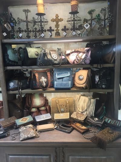 An array of western-style leather purses & wallets.