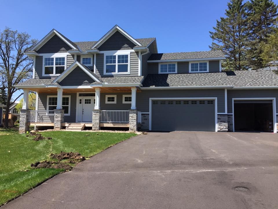 A large house with a garage and a driveway