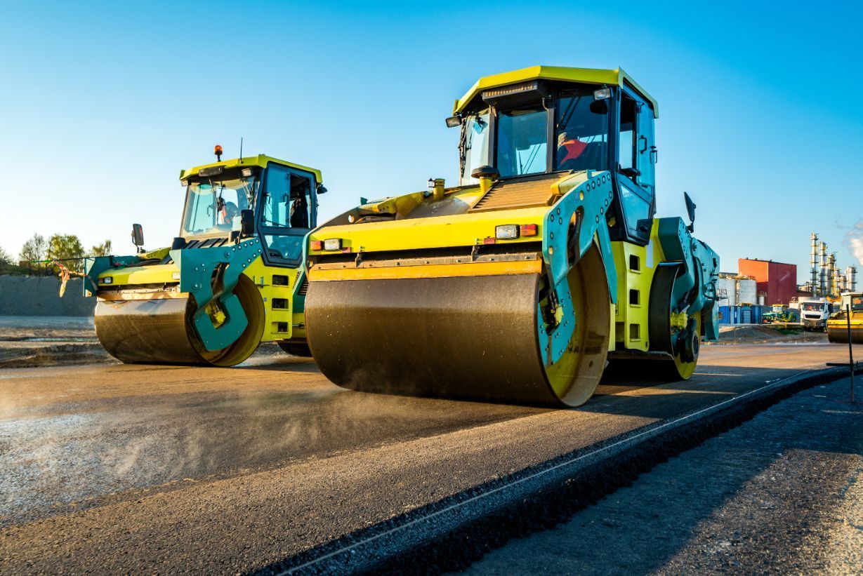 Two Asphalt Rollers are Driving down a road. — Potholes ‘R’ Us In Toowoomba, QLD