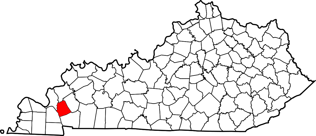 A black and white map of the state of kentucky with a red circle in the middle.