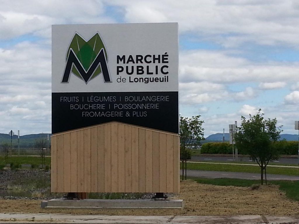 Un panneau indiquant marche publique de longueuil dessus