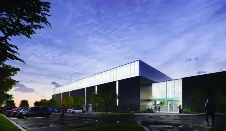 Une impression d'artiste d'un grand bâtiment avec un parking devant.