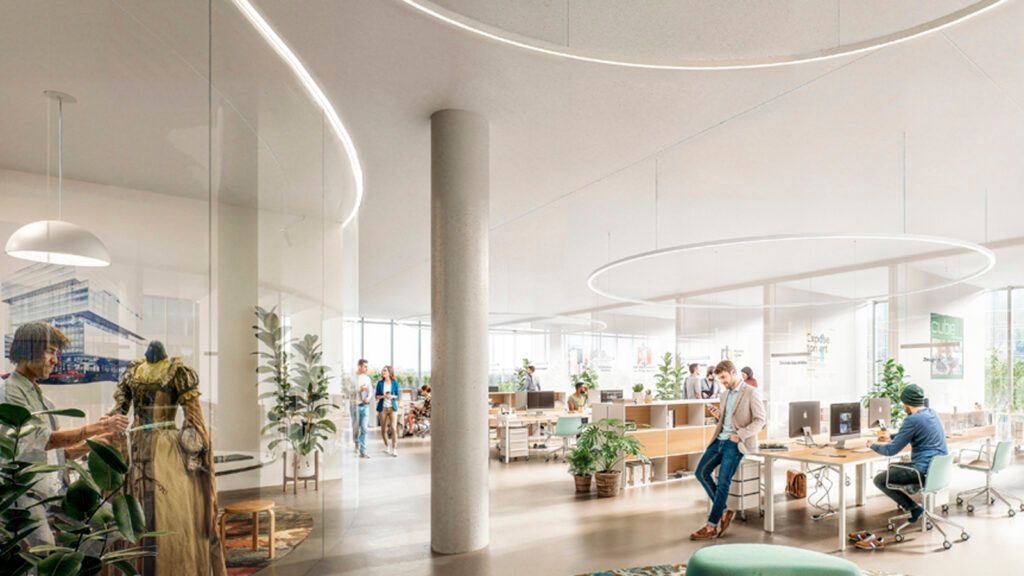 Un groupe de personnes sont assises à des bureaux dans un bureau.