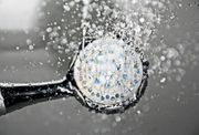 Shower head with water spraying outwards.