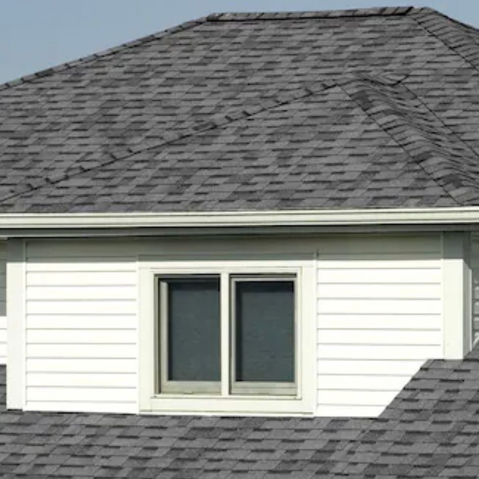 A brown roof with a window on top of it