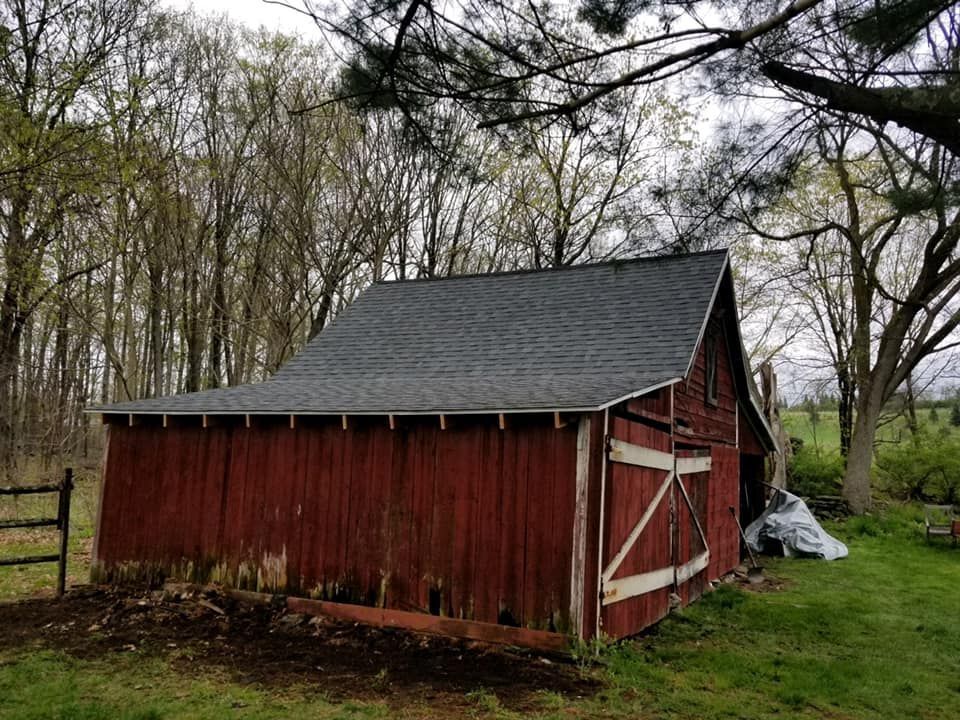 A brown roof with a window on top of it