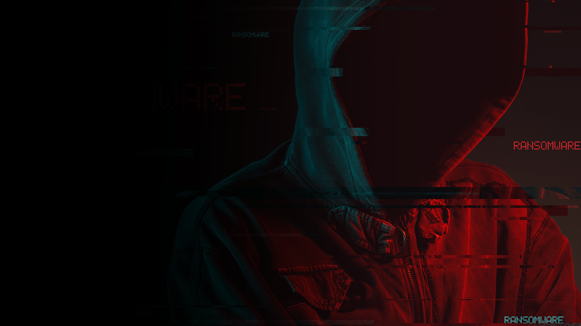 a man in a hooded jacket is looking at a computer screen .