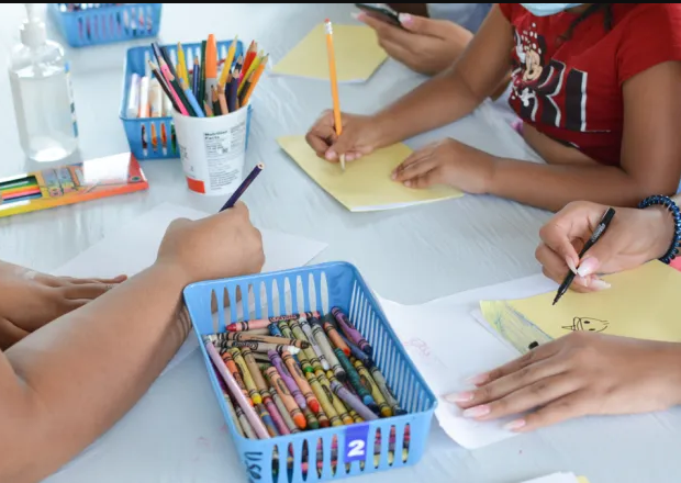 A basket of colored pencils has the number 2 on it