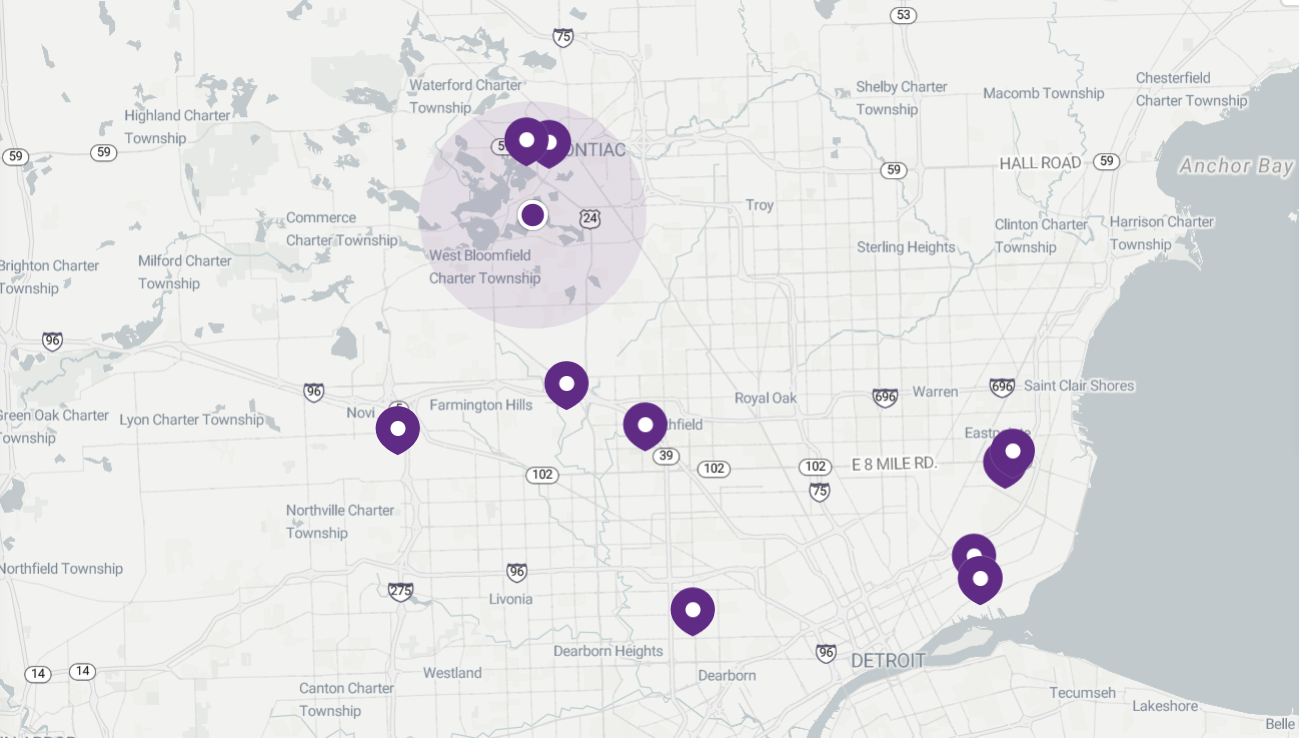 Map with purple markers indicating locations, one with a shaded radius.