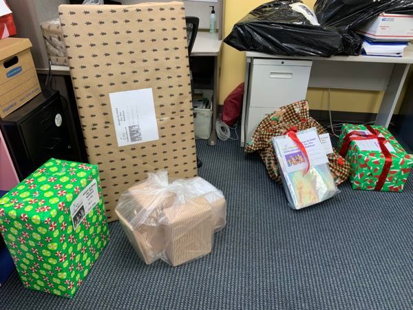 A bunch of boxes are sitting on the floor in a room