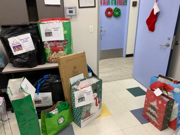 A room filled with lots of christmas presents and bags