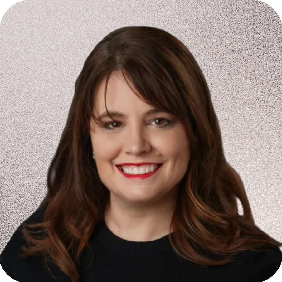 A woman wearing a black shirt and red lipstick smiles for the camera