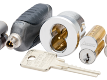 A bunch of different types of locks and keys on a white background.