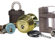 A variety of padlocks and keys are displayed on a white background