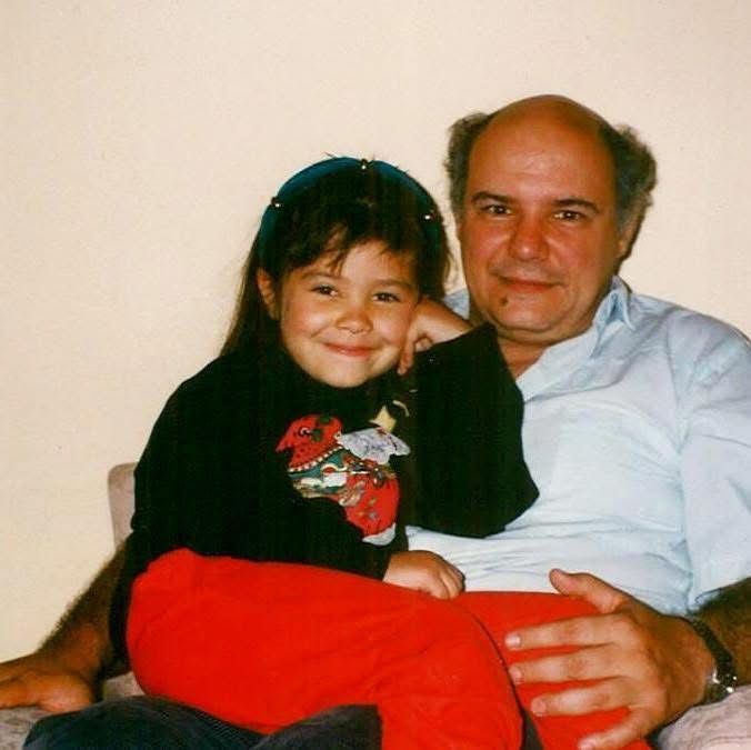 Papi and his daughter are posing for a picture