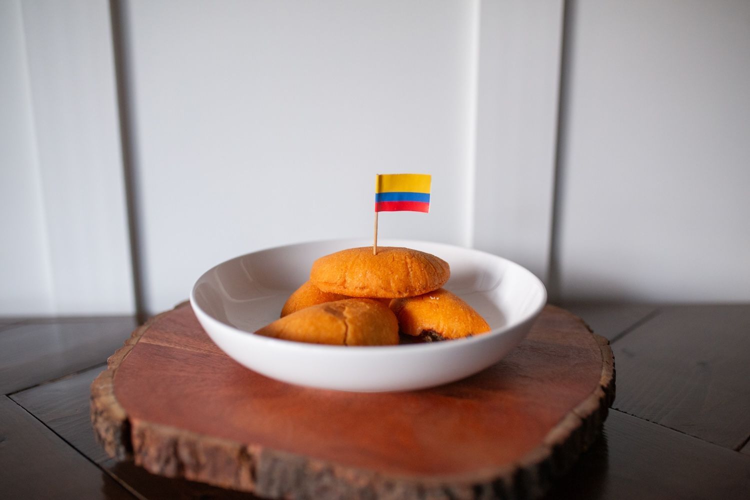 A bowl of food with a small flag sticking out of it.