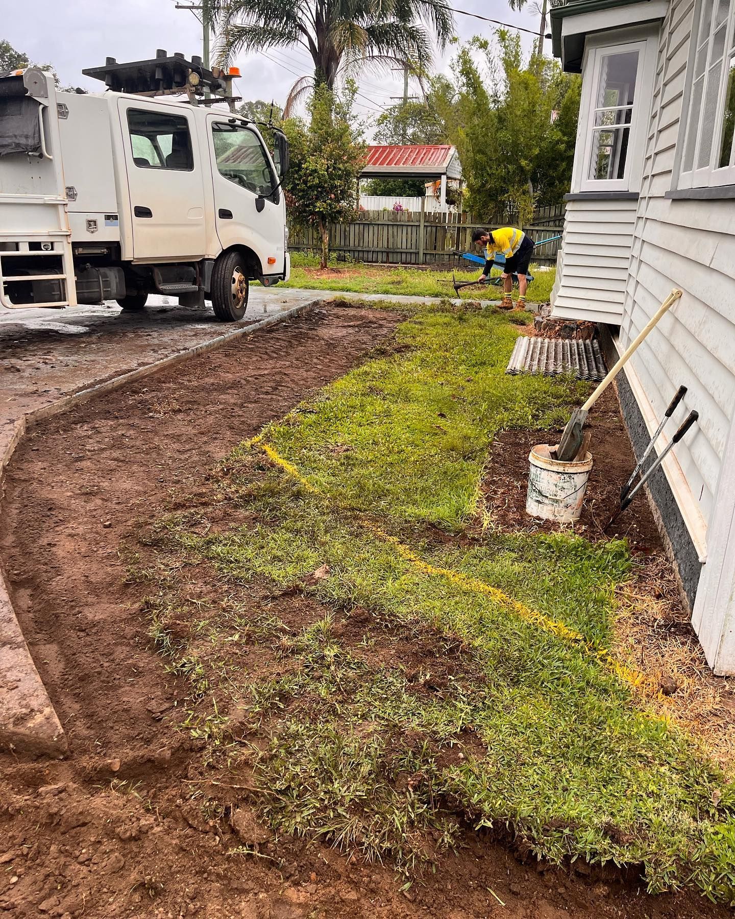 Truck, Worker, Preparing Lawn Next to a House, Dirt Path, Green Grass — All Access Mini Earthworks  in Innes Park, QLD
