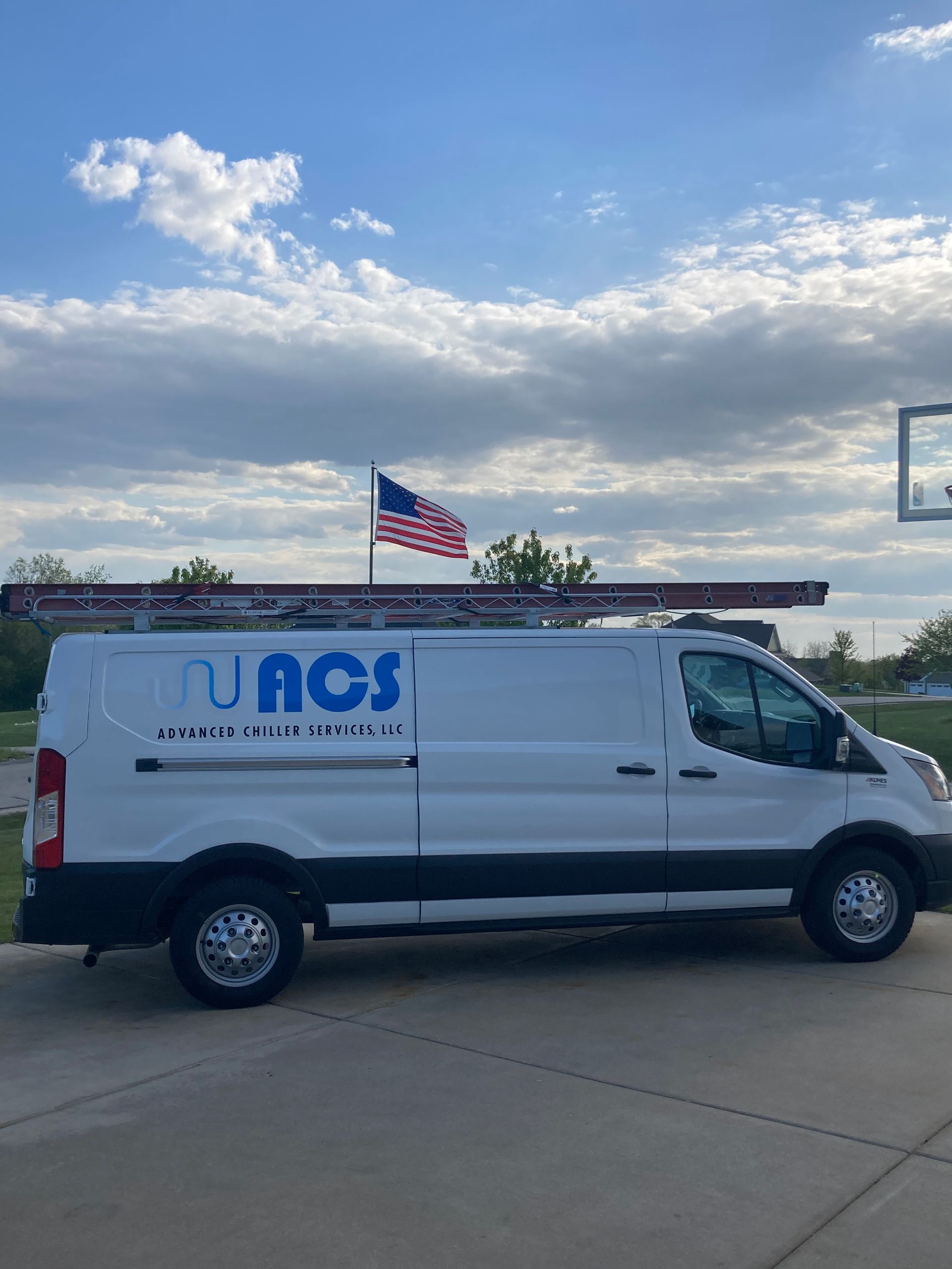Pink industrial turbine with exposed blades, likely in a factory or power plant setting.