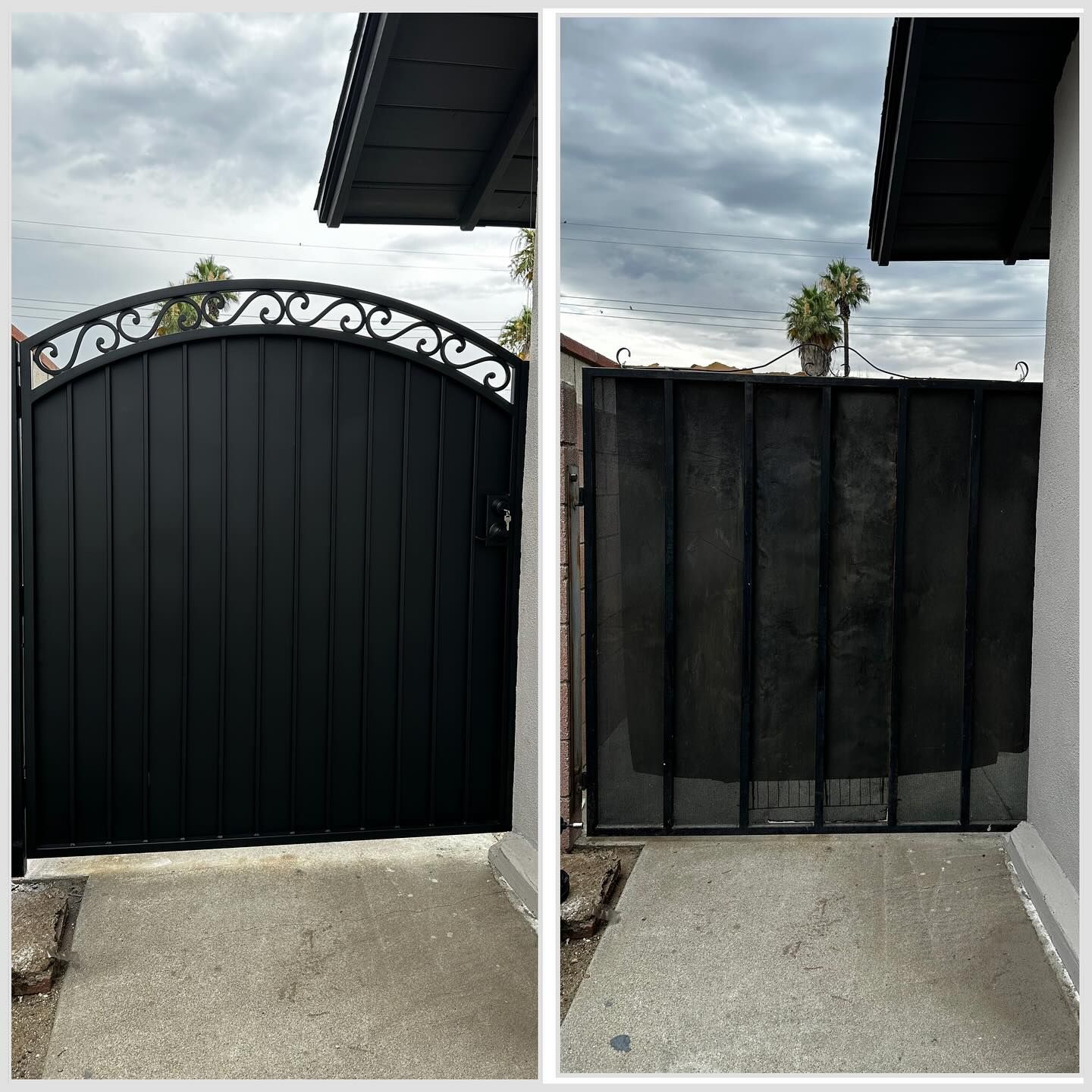 A black gate with a white design on it is in front of a house.