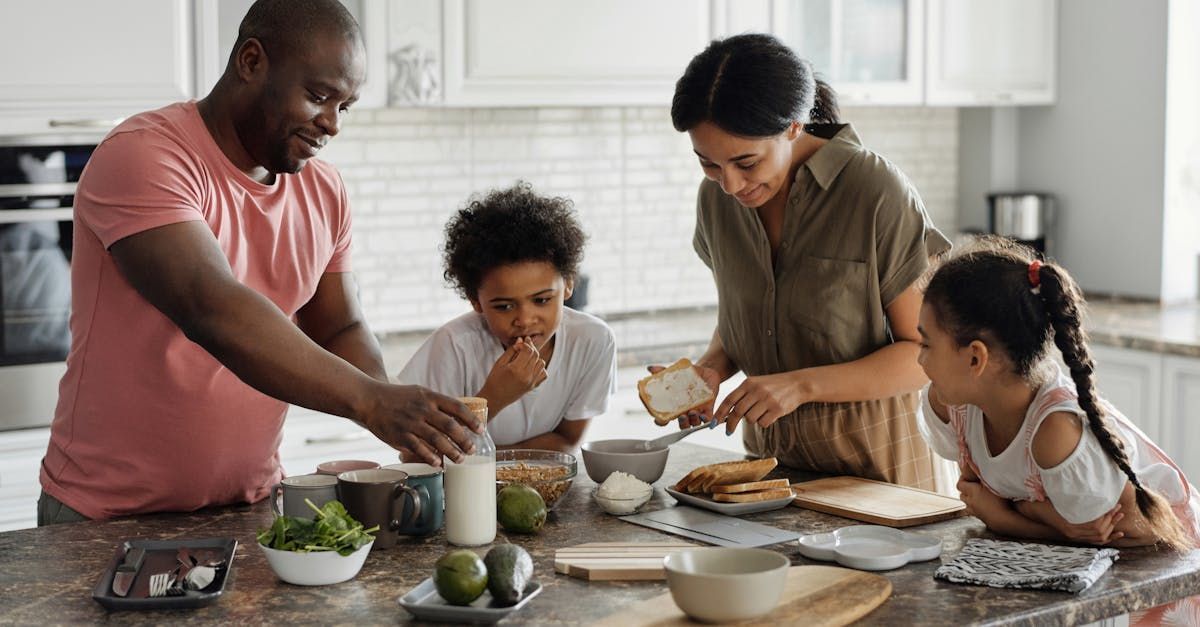 A family is preparing food together in the kitchen.