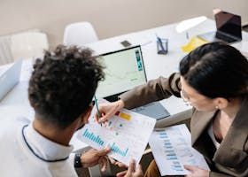 advisor pointing to different investment options