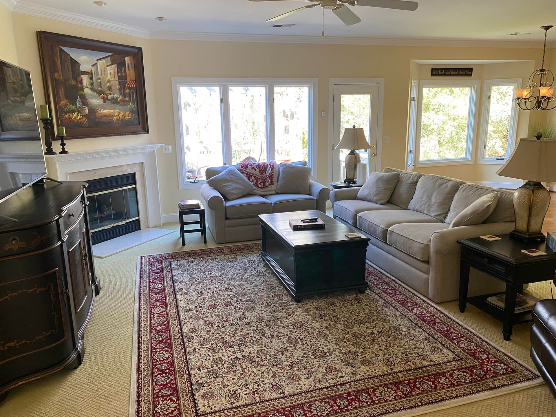 A living room filled with furniture and a fireplace.