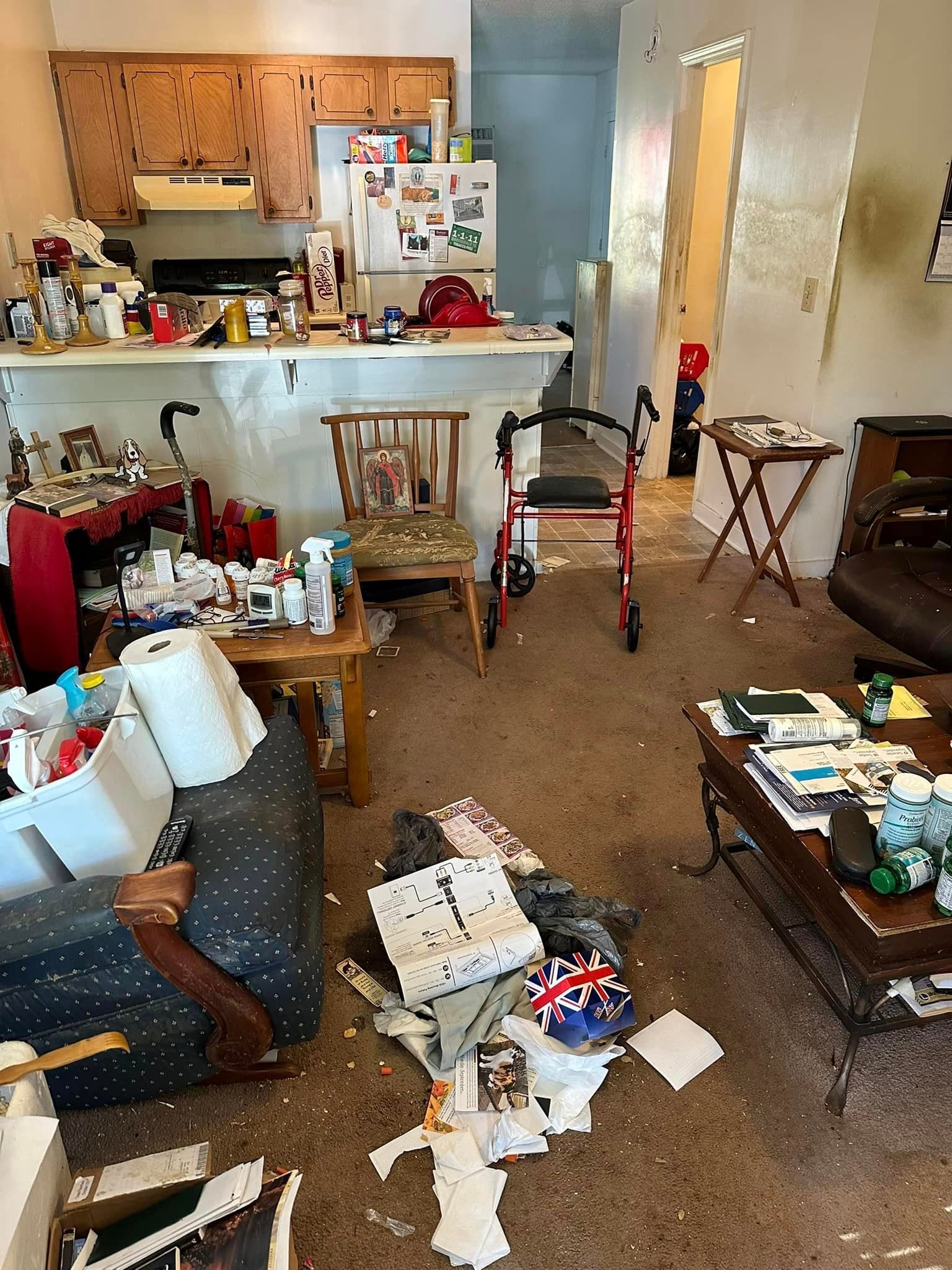 A living room filled with furniture and a walker.