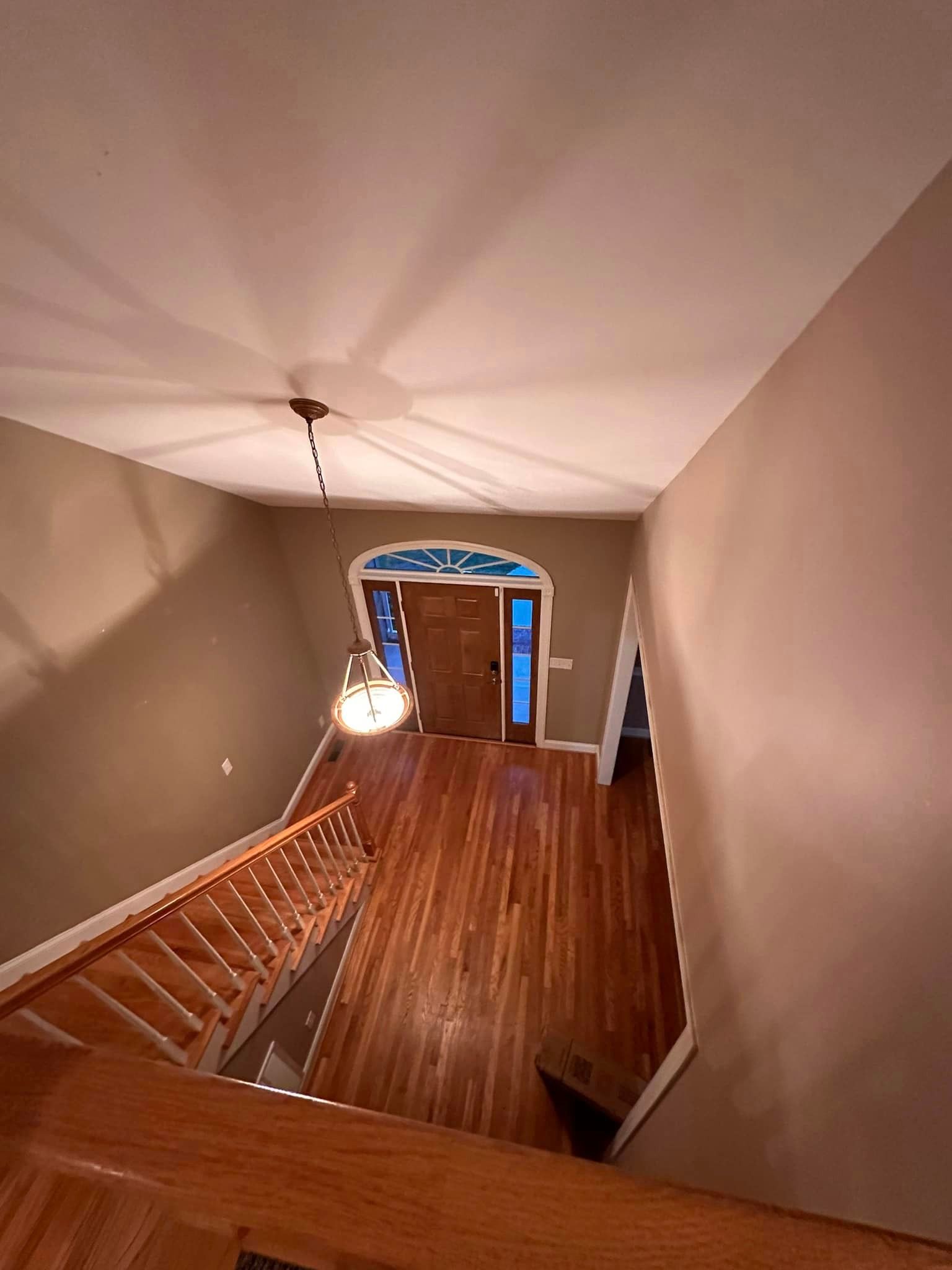 A view of a hallway from the second floor of a house.