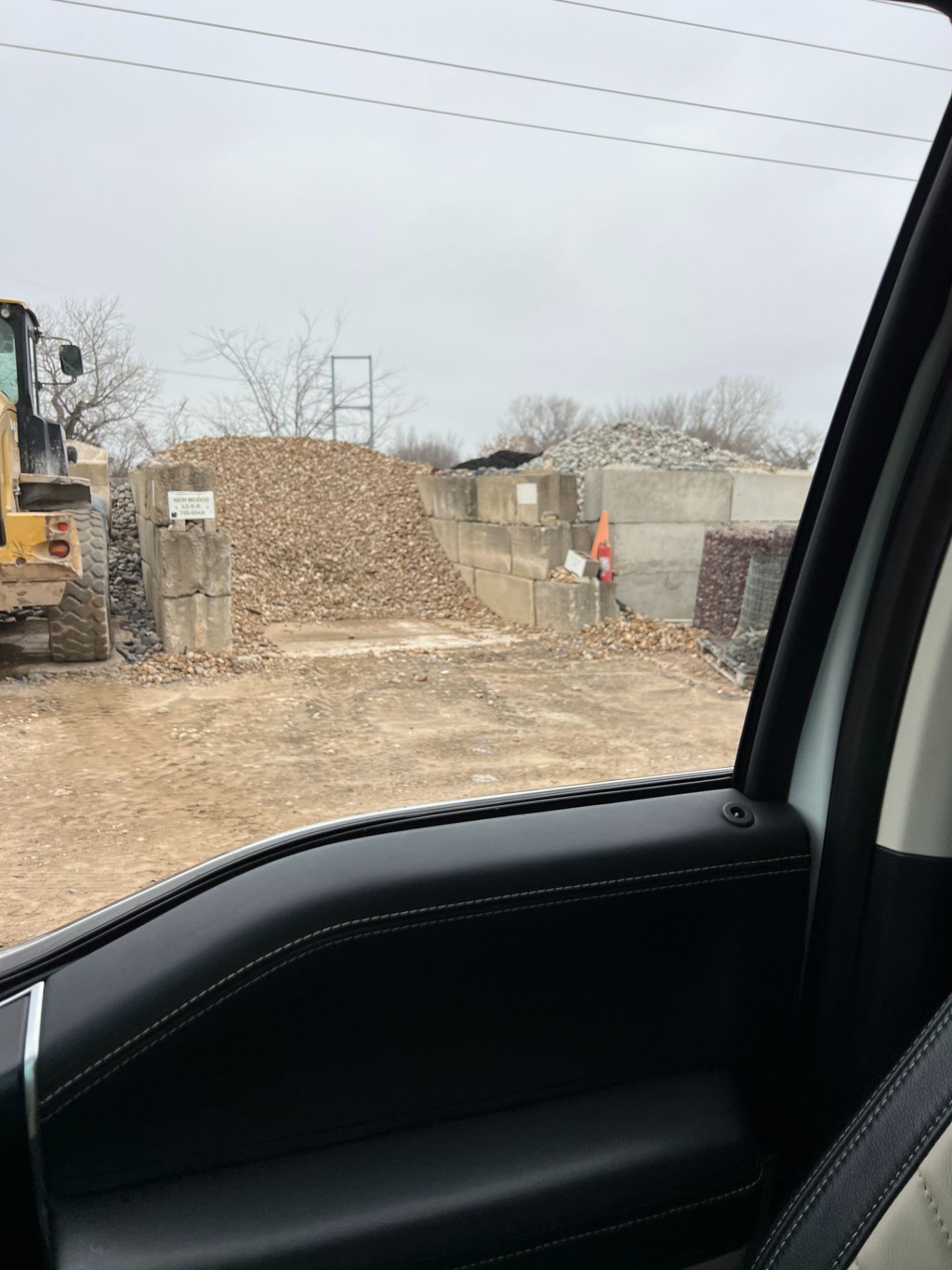 A view of a construction site from a car window.