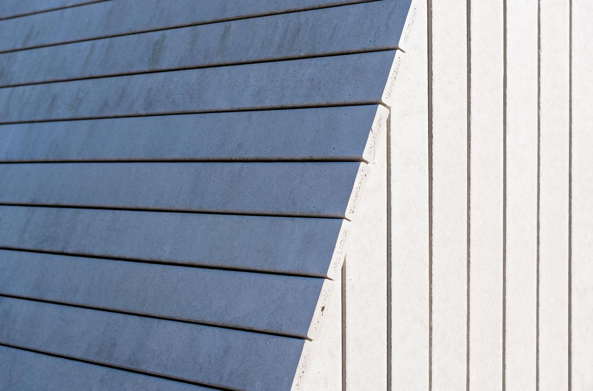 a close up of a blue and white siding on a building