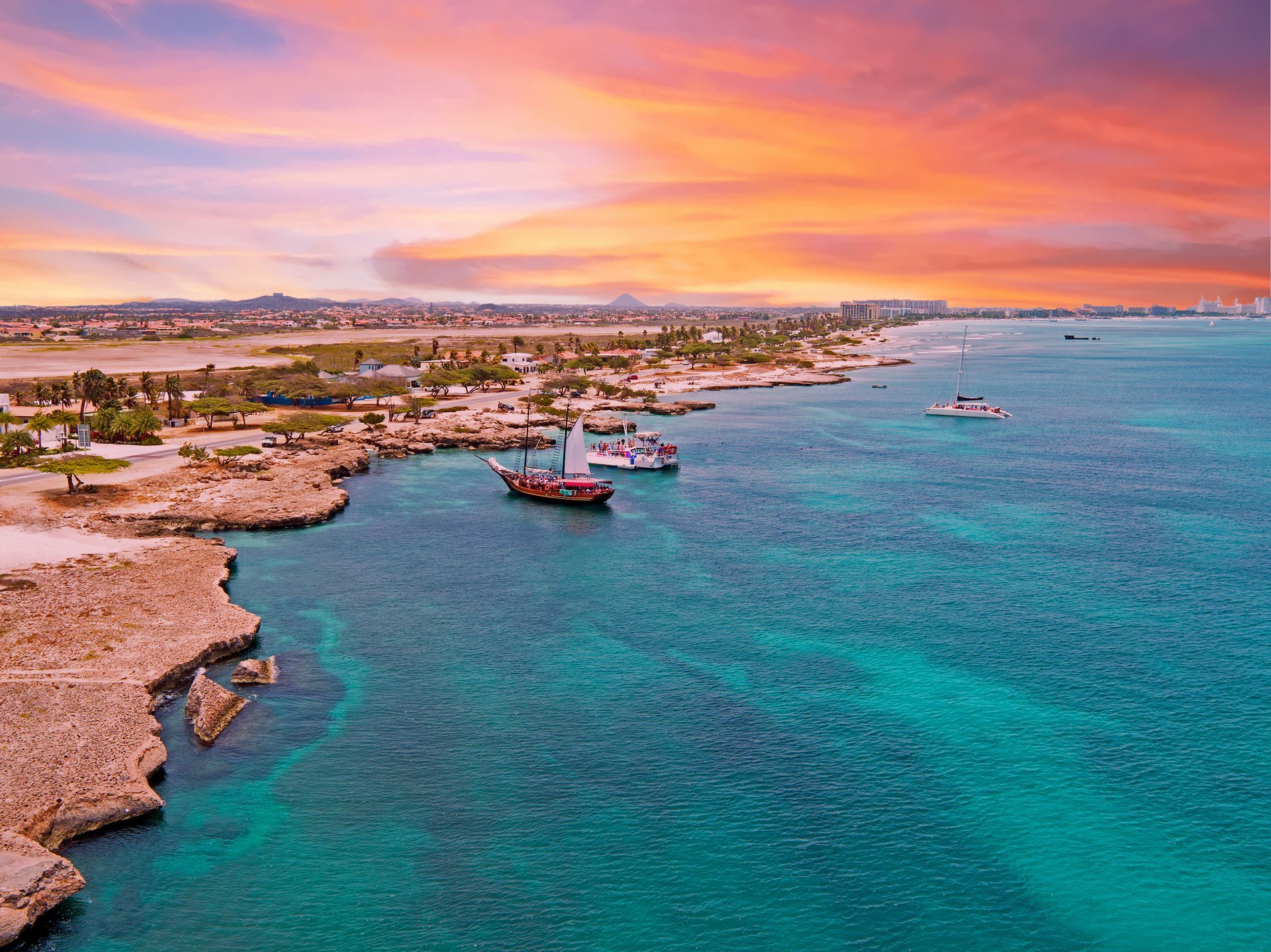 An aerial view of a large body of water with boats in it.