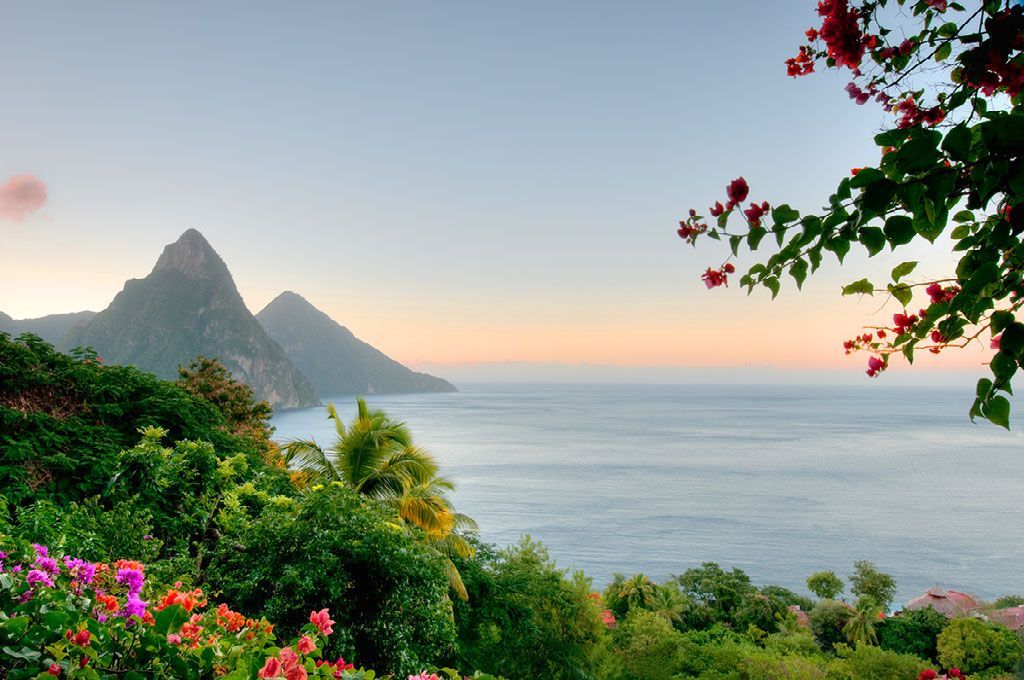 A view of the ocean with a mountain in the background