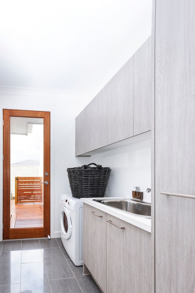 Narrow Laundry Room with Gray Cabinets and Washing Machine — WJG Built in Wollongbar, NSW