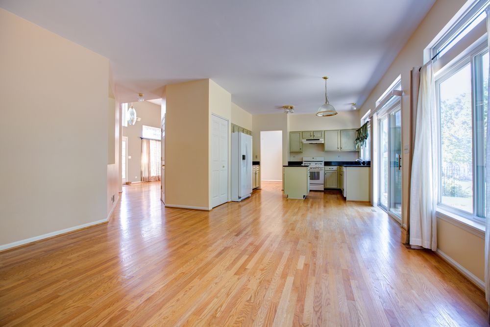 Empty Open Plan Living Room and Kitchen with Hardwood Floors — WJG Built in Lismore, NSW