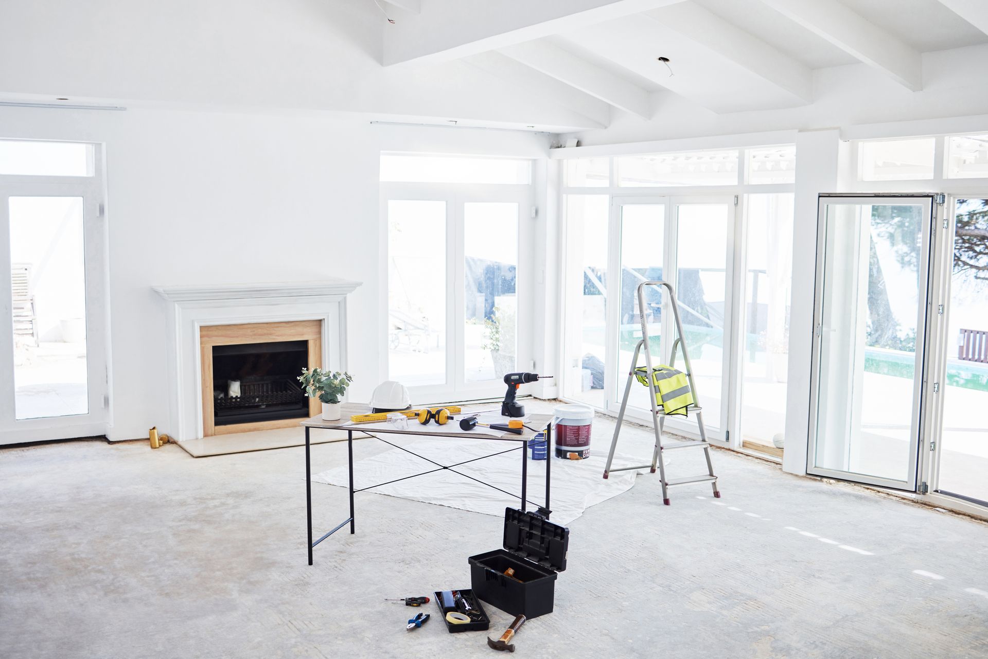 Bright Unfinished Living Room with Fireplace During Renovation — WJG Built in Lismore, NSW